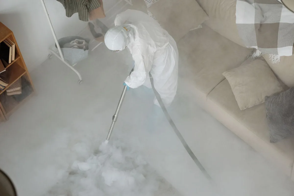 Biohazard cleanup technician in protective equipment, Hoosick Falls, NY